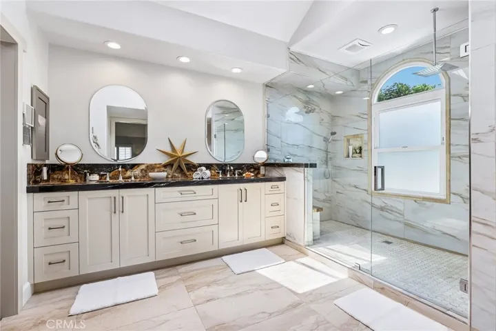 Primary Bath with custom granite and tile throughout.