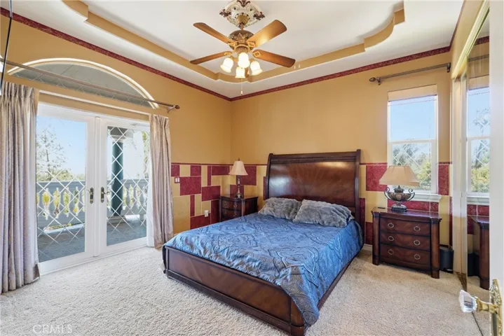 First bedroom upstairs with balcony access