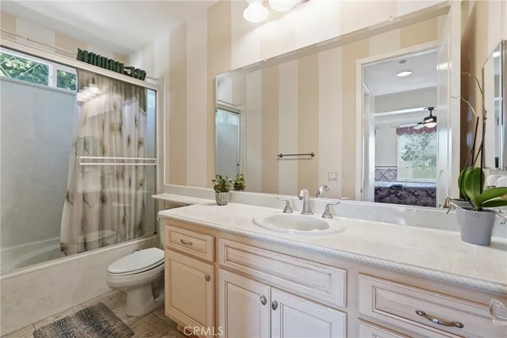 Full bathroom in primary floor suite