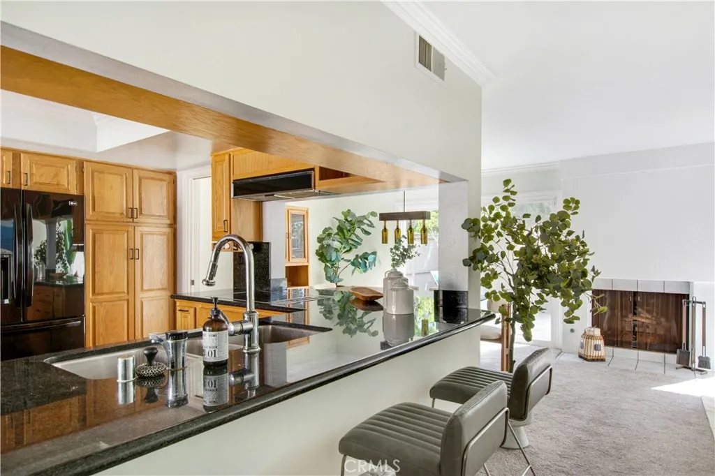 Breakfast bar located at entry to family room