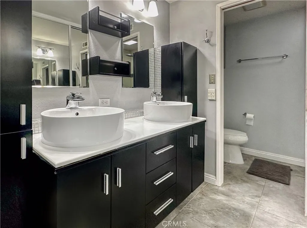 Primary Bathroom with double vanity and walk-in shower