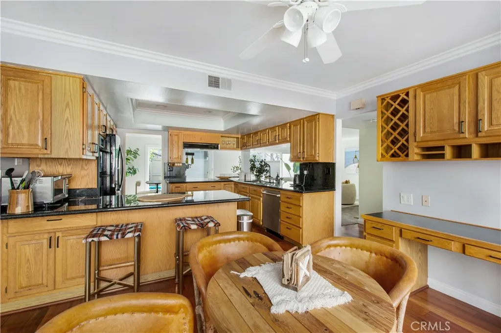 Another view of 2nd dining area and breakfast bar leading into kitchen.