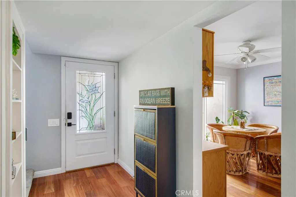 Main entrance including wood flooring and entry into 2nd dining space area.