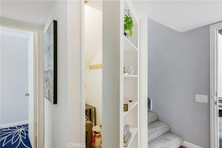 Hidden storage area and entry into main floor half bathroom.