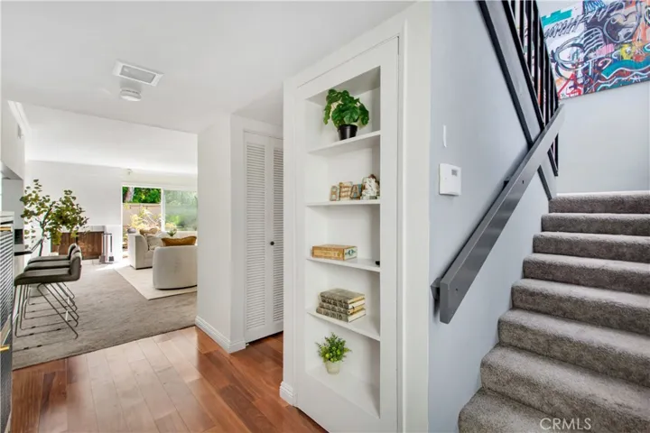 Hidden storage area and coat closet at entry and stairway to 2nd floor.