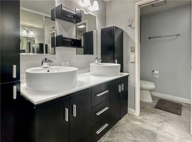 Primary Bathroom with double vanity and walk-in shower