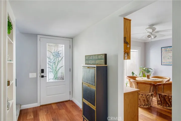 Main entrance including wood flooring and entry into 2nd dining space area.