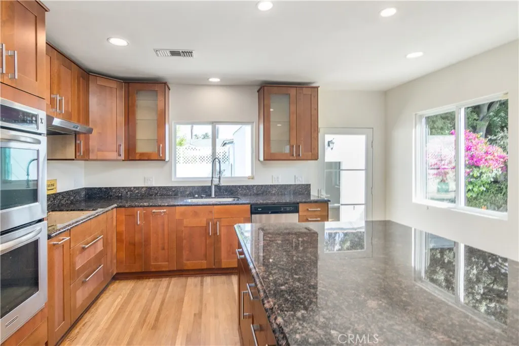 Kitchen with picture window overlooking pool