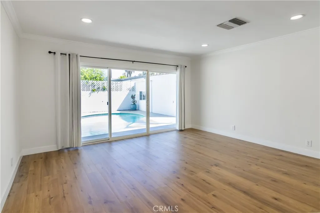 Primary bedroom with en-suite full bath - sliding glass doors to pool