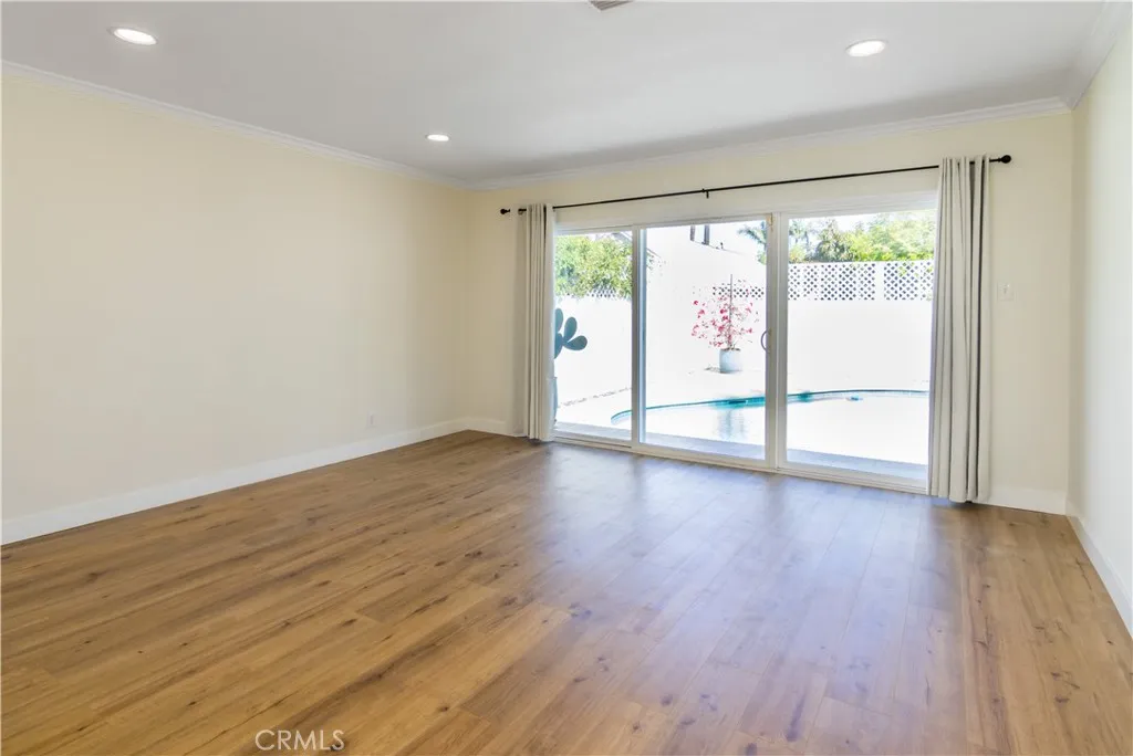 Primary bedroom with en-suite full bath - sliding glass doors to pool