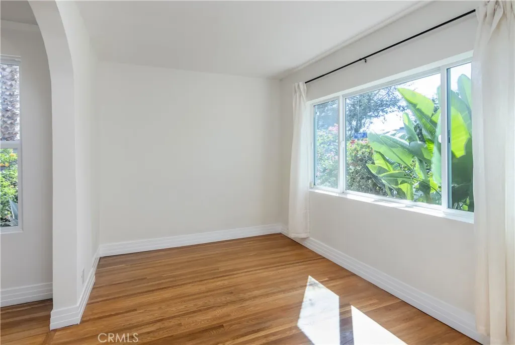 Sunlit sitting room offers a flexible space ideal for a media lounge, reading retreat, or home office
