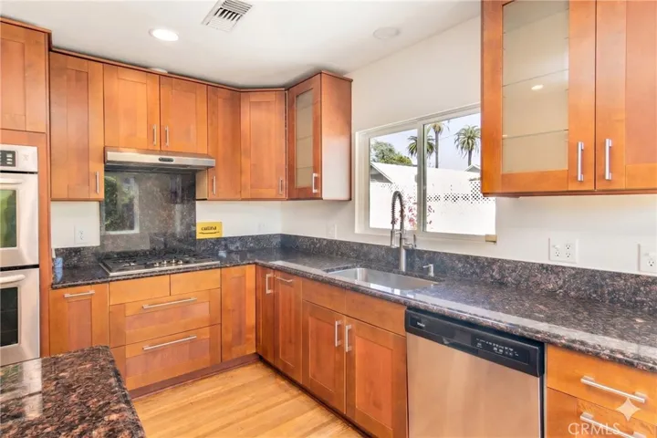 Kitchen with picture window overlooking pool