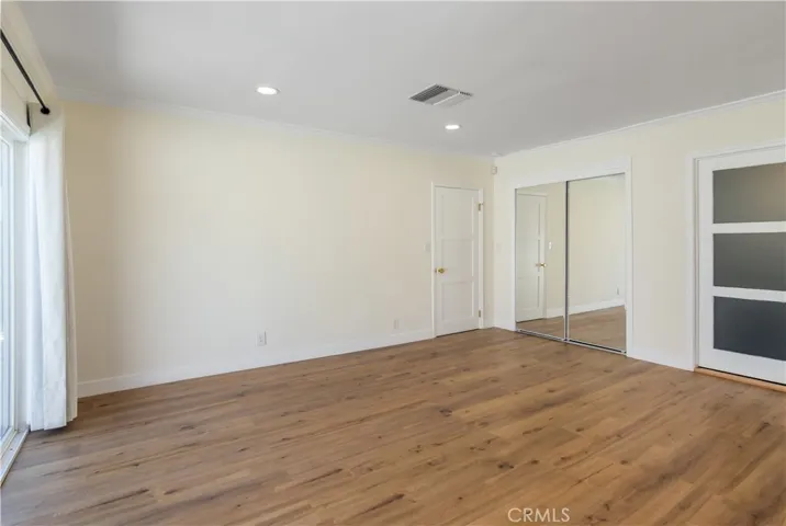Primary bedroom with en-suite full bath - sliding glass doors to pool