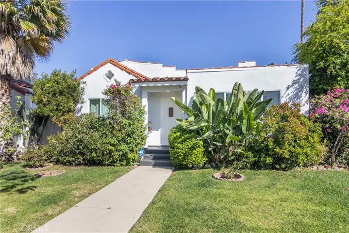 Commanding Corner Lot with Timeless Curb Appeal