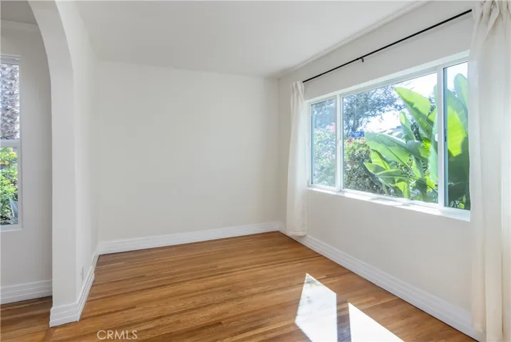 Sunlit sitting room offers a flexible space ideal for a media lounge, reading retreat, or home office
