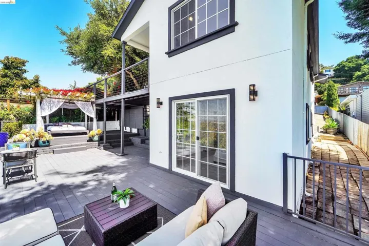 Spacious outdoor deck featuring gray composite decking