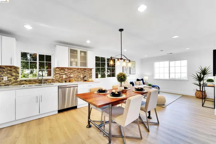 Open-concept living space featuring light wood-finish flooring