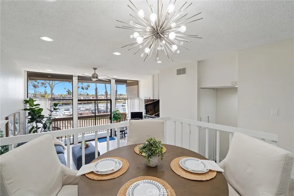 Dining area overlooking the living area and water views