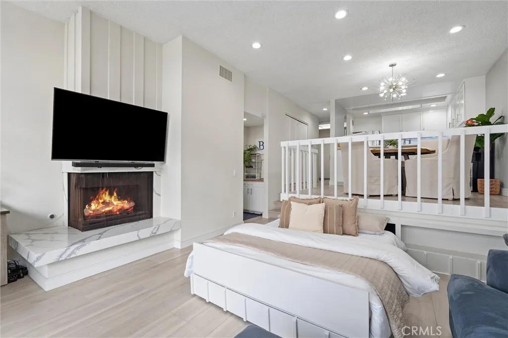 Fireplace digitally enhanced and is operable during limited months per HOA. Motorized guest bed disappears back under the dining room