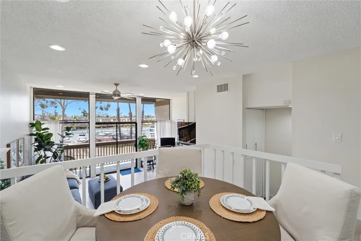 Dining area overlooking the living area and water views