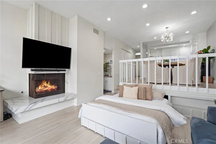 Fireplace digitally enhanced and is operable during limited months per HOA. Motorized guest bed disappears back under the dining room