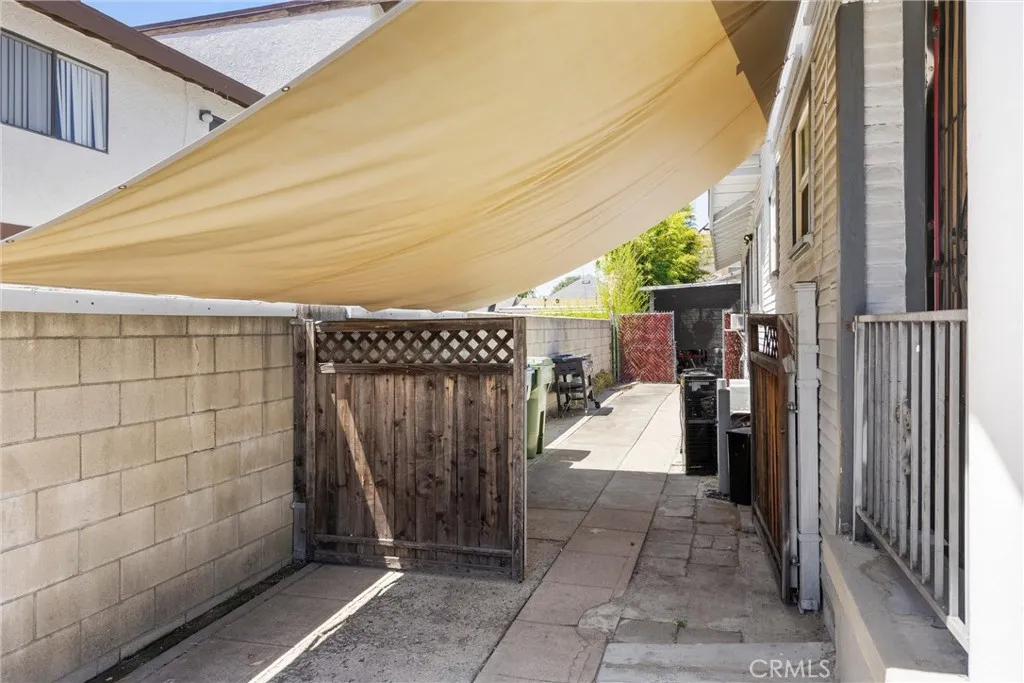 sideyard leading to garage and studio