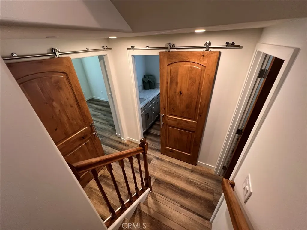 Coming down stairs to bedrooms and bathrooms