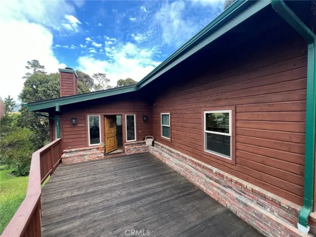 From gate, looking at deck towards front door off of Spencer