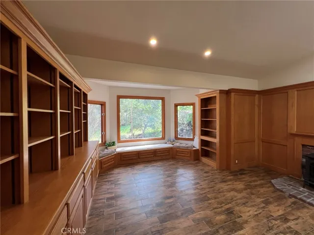 Lots of built ins for a library, studio, media room.