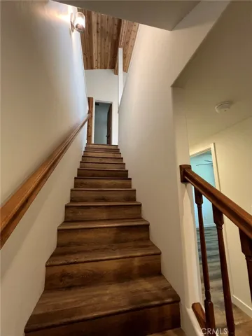 Downstairs to bedrooms and full bathrooms