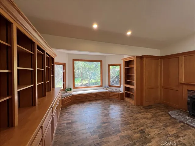 Lots of built ins for a library, studio, media room.