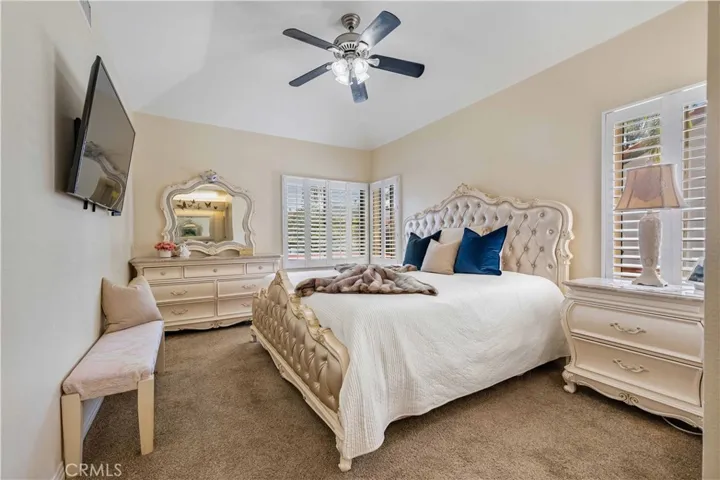 Generous Sized Primary with View of Community Pool