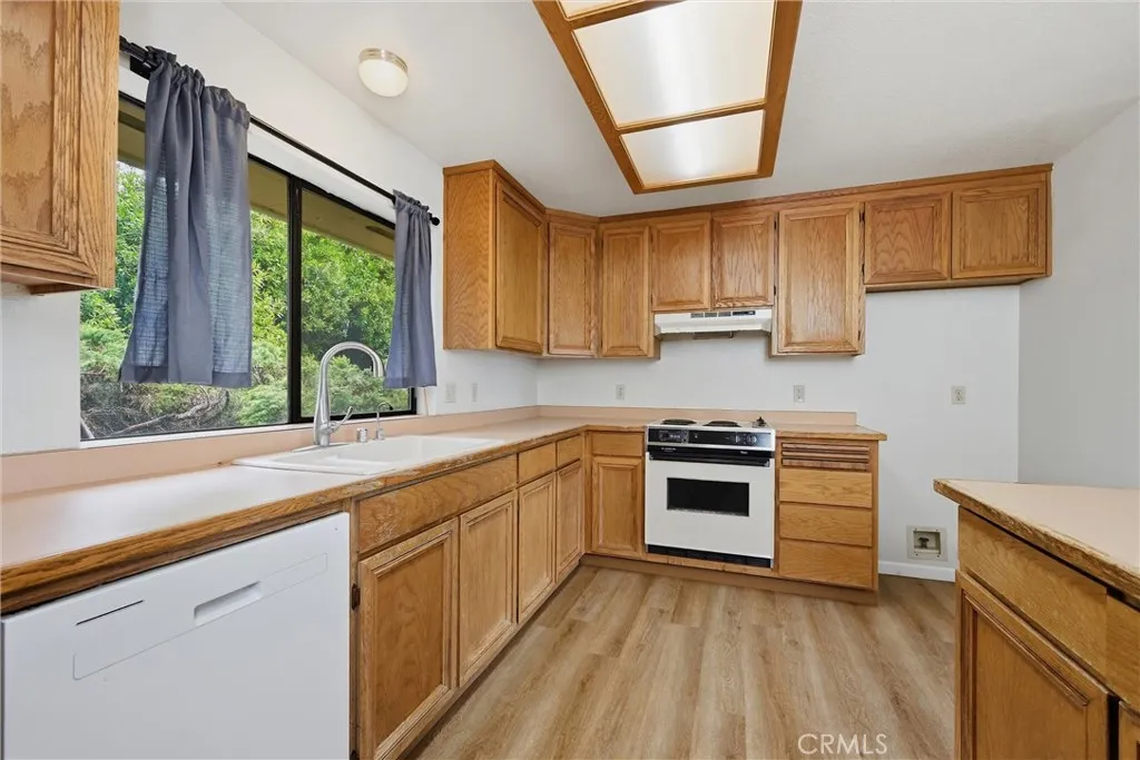 Kitchen has large window overlooking the courtyard.