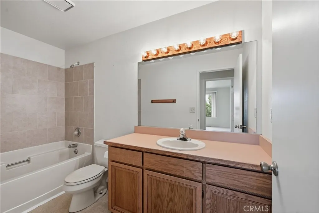 Hall bath with shower over tub.