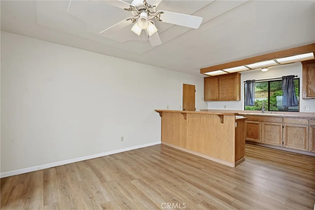 Dining area looking toward kitchen across breakfast bar.