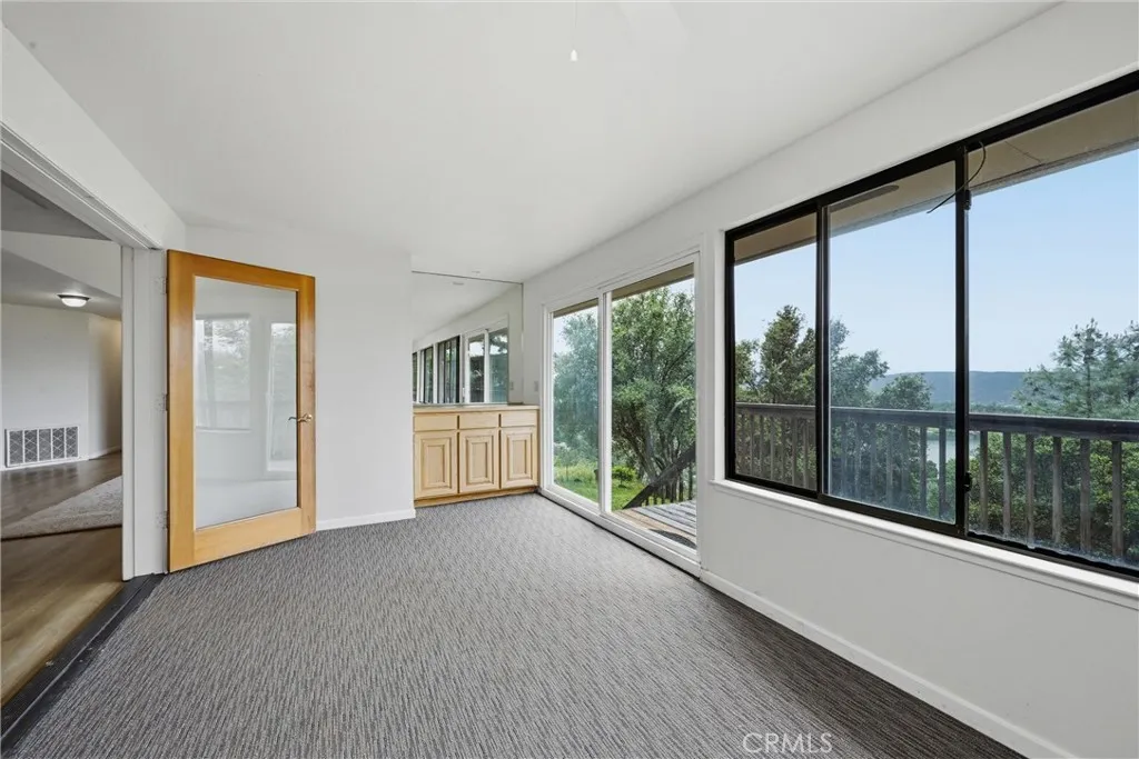 Sun room has wet bar.