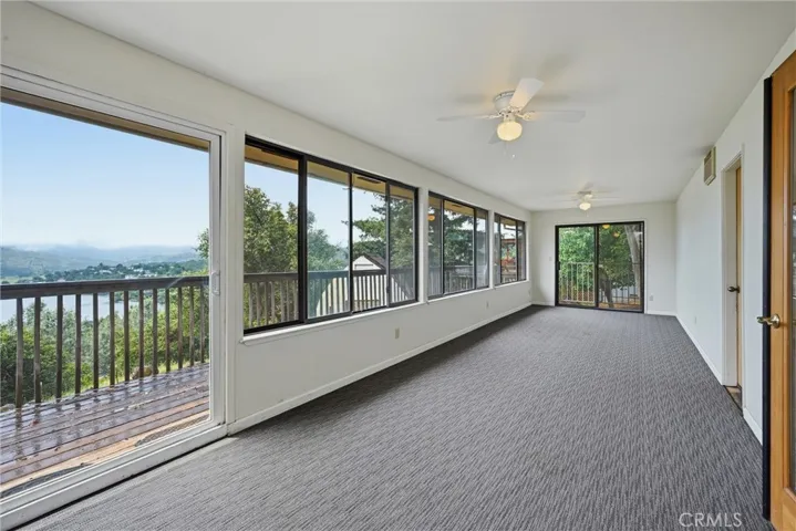 Sun room opens to back deck.