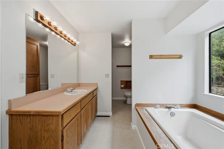 Primary bathroom has soaking tub.