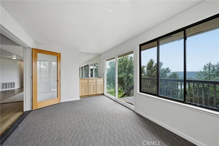 Sun room has wet bar.