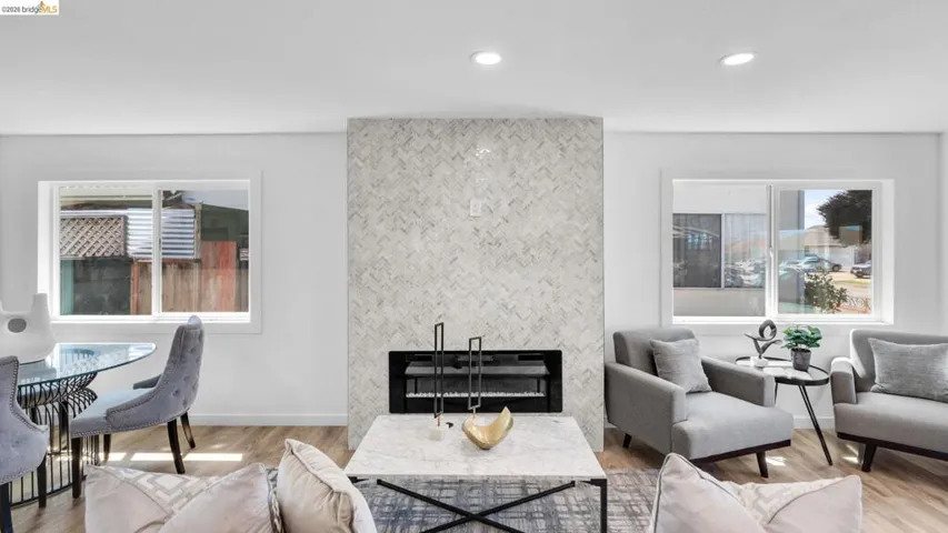 Herringbone tile fireplace with an integrated firebox