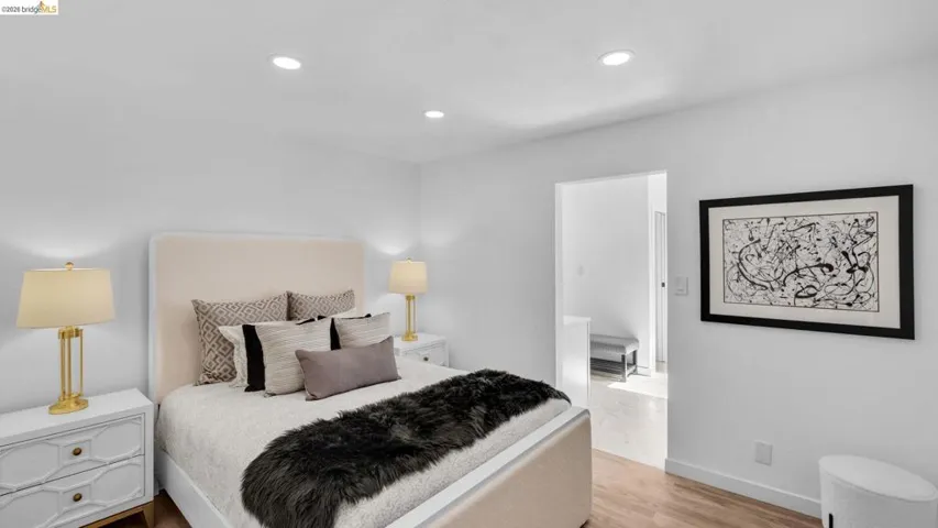 Bright interior space featuring recessed lighting and light wood-finish flooring
