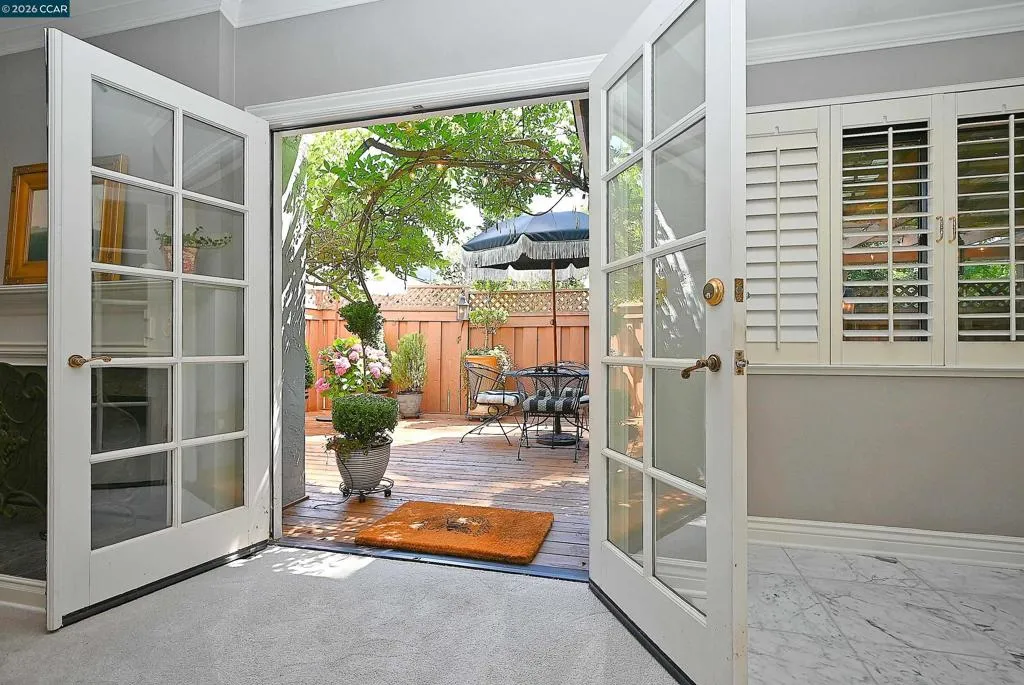 Living room doors out to backyard patio Living room doors out to backyard patio