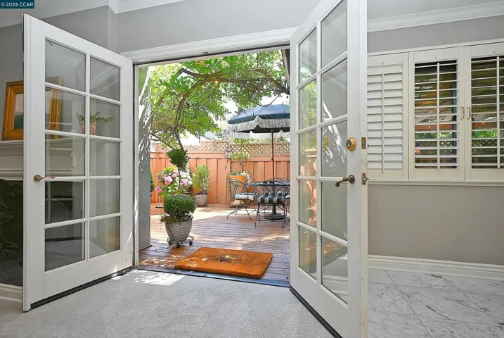 Living room doors out to backyard patio