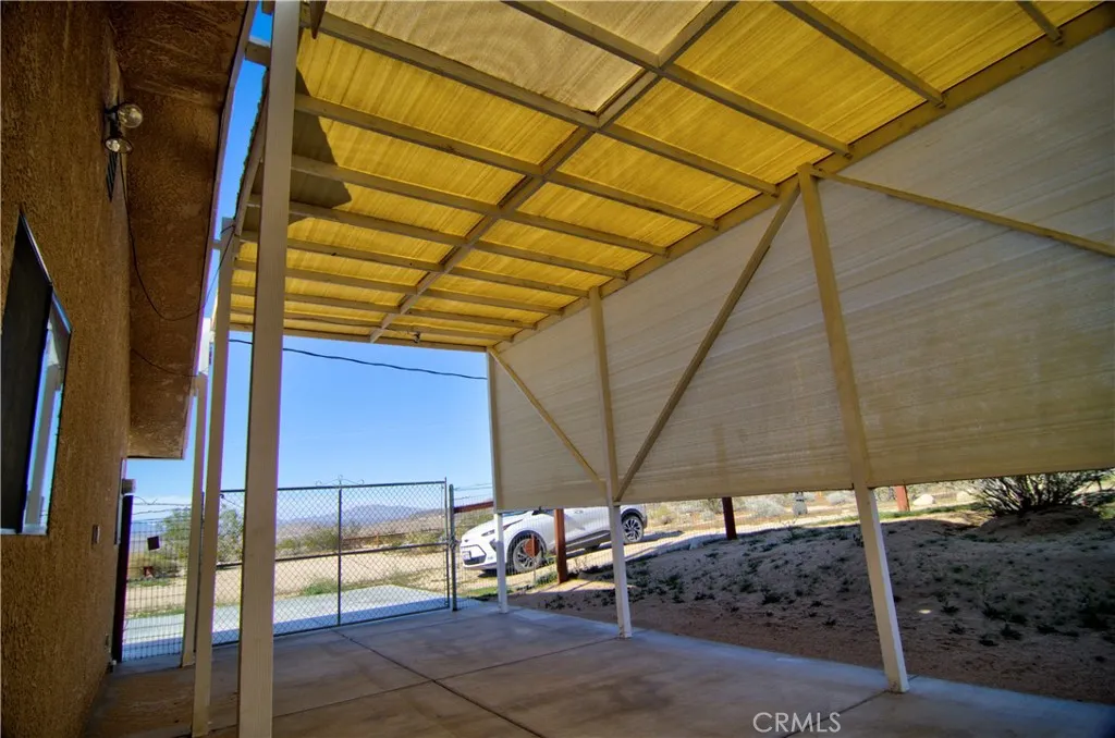This is an RV parking spot. It is covered with shade cloth that has held up really well. It's about 4 years old.