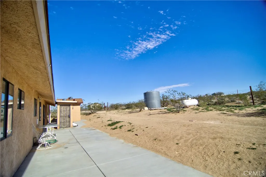 This shows the concrete slab in the back with a small pump room for water.