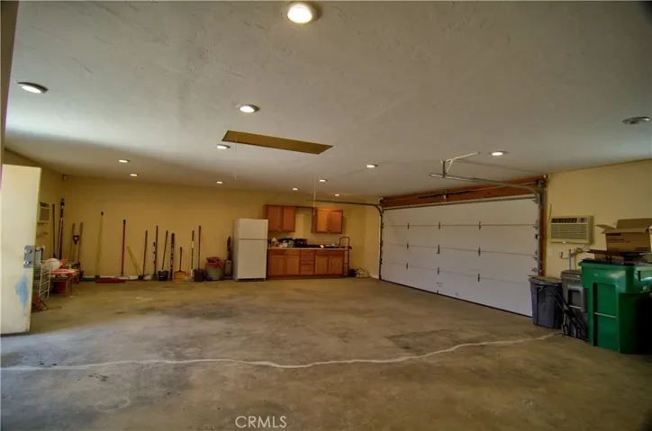 What person doesn't want a huge garage. There are two 240V wall airc onditioners in the garage that can keep it cool.