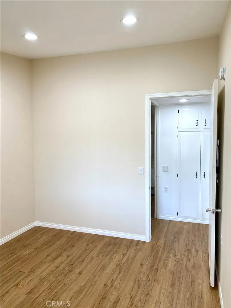main bedroom with vaulted ceilings, and recessed lighting