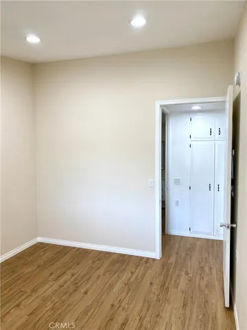 main bedroom with vaulted ceilings, and recessed lighting