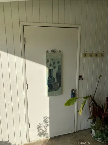small storage closet at front porch