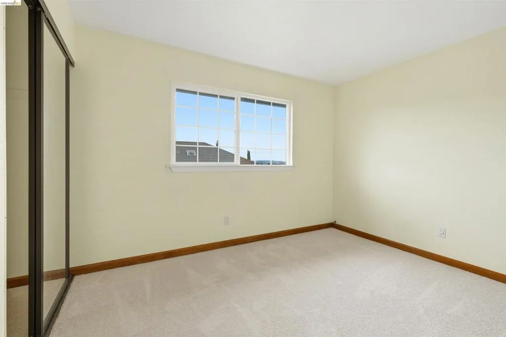 Light-colored walls complementing soft carpeting